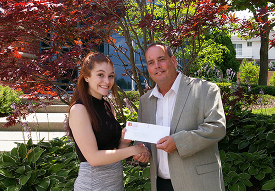 2017 President Jim Smith hands in the scholarship cheque to Felicidy Hocking