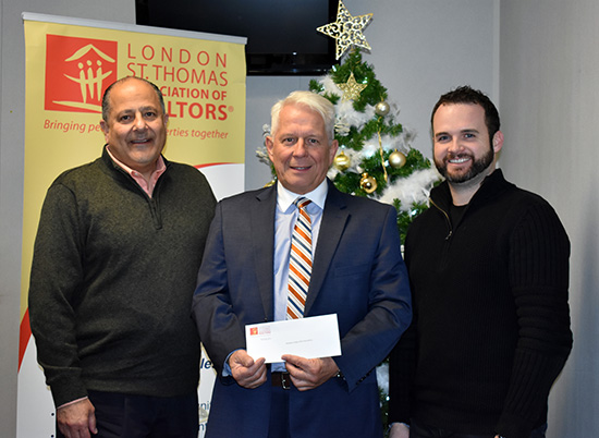 Cheque Presentation to Hockey Helps the Homeless