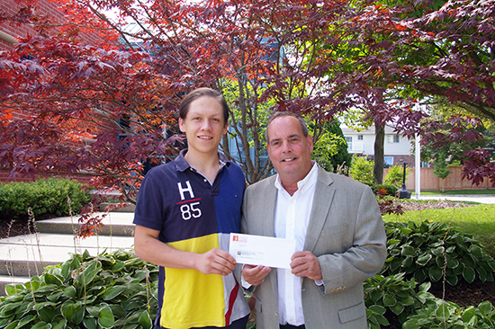 2017 President Jim Smith hands in the scholarship cheque to Jack Peifer-Dawson