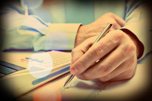 Man signing incorporation documents