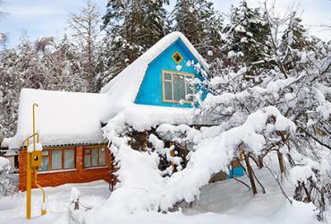 House and Garden Covered in Snow