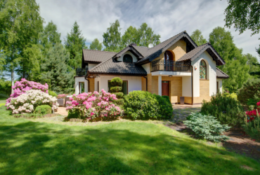 luxury home in summer with lush gardens
